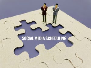 social media scheduling written on purple background with puzzle around it and two figurines