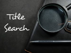 title search written in white on black background and magnifying glass