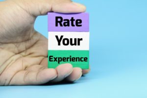 rate your experience written on three different colored blocks