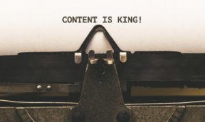 content is king written on paper using old typewriting